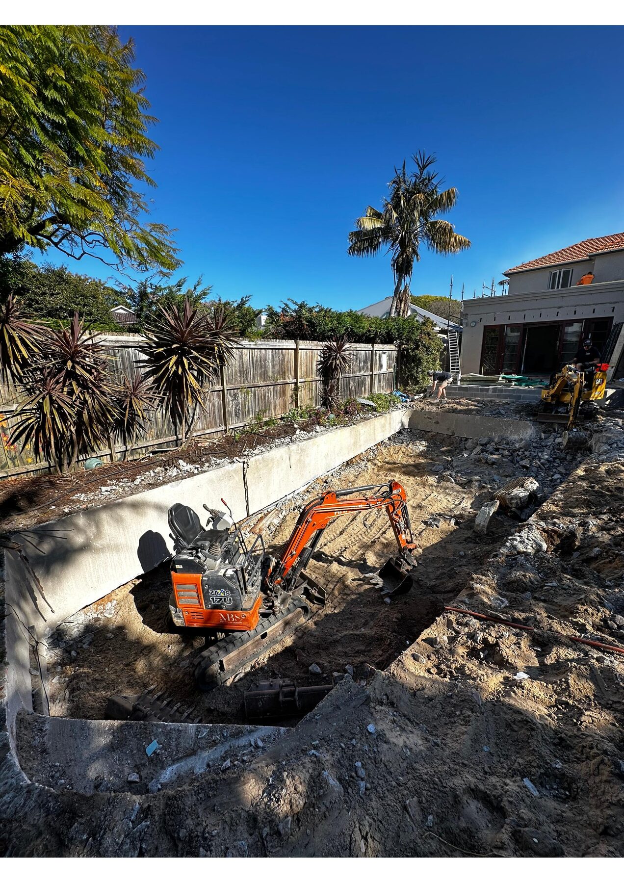MBS-branded Hitachi mini excavator working in a pool excavation at Rose Bay